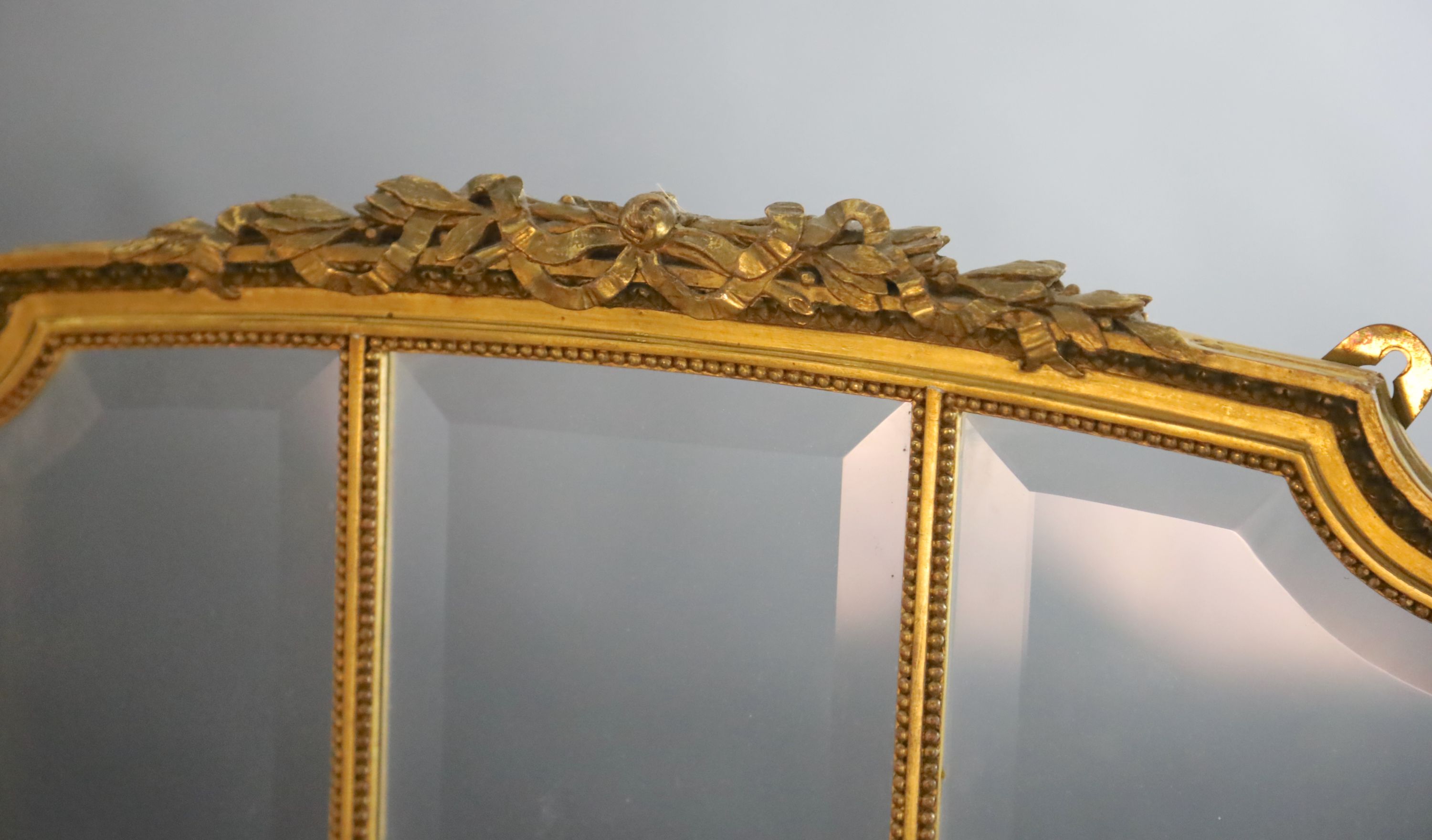 An early 20th century French giltwood three fold dressing screen, W.1ft 7in. H.4ft 9.5in.